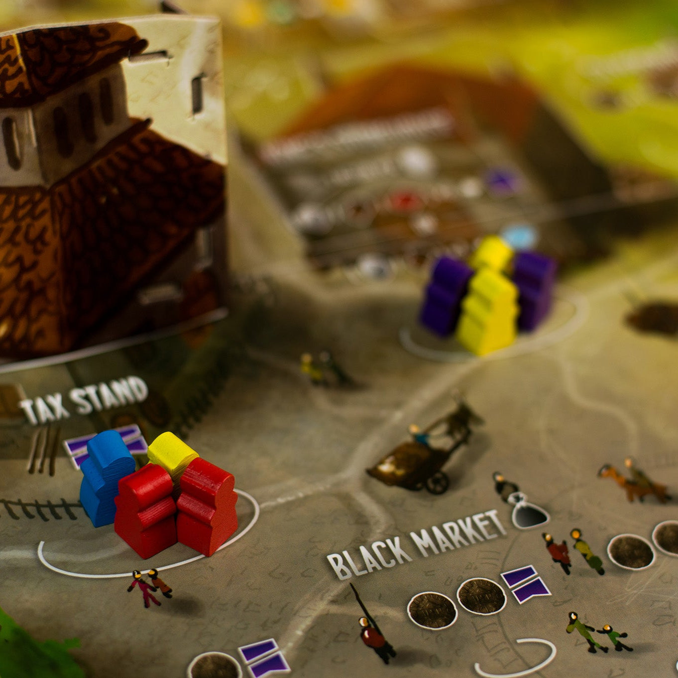 Board game setup with a tax stand and various game pieces on a map labeled 'Black Market'.