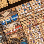 Close-up of a board game with various components and cards on a wooden surface.